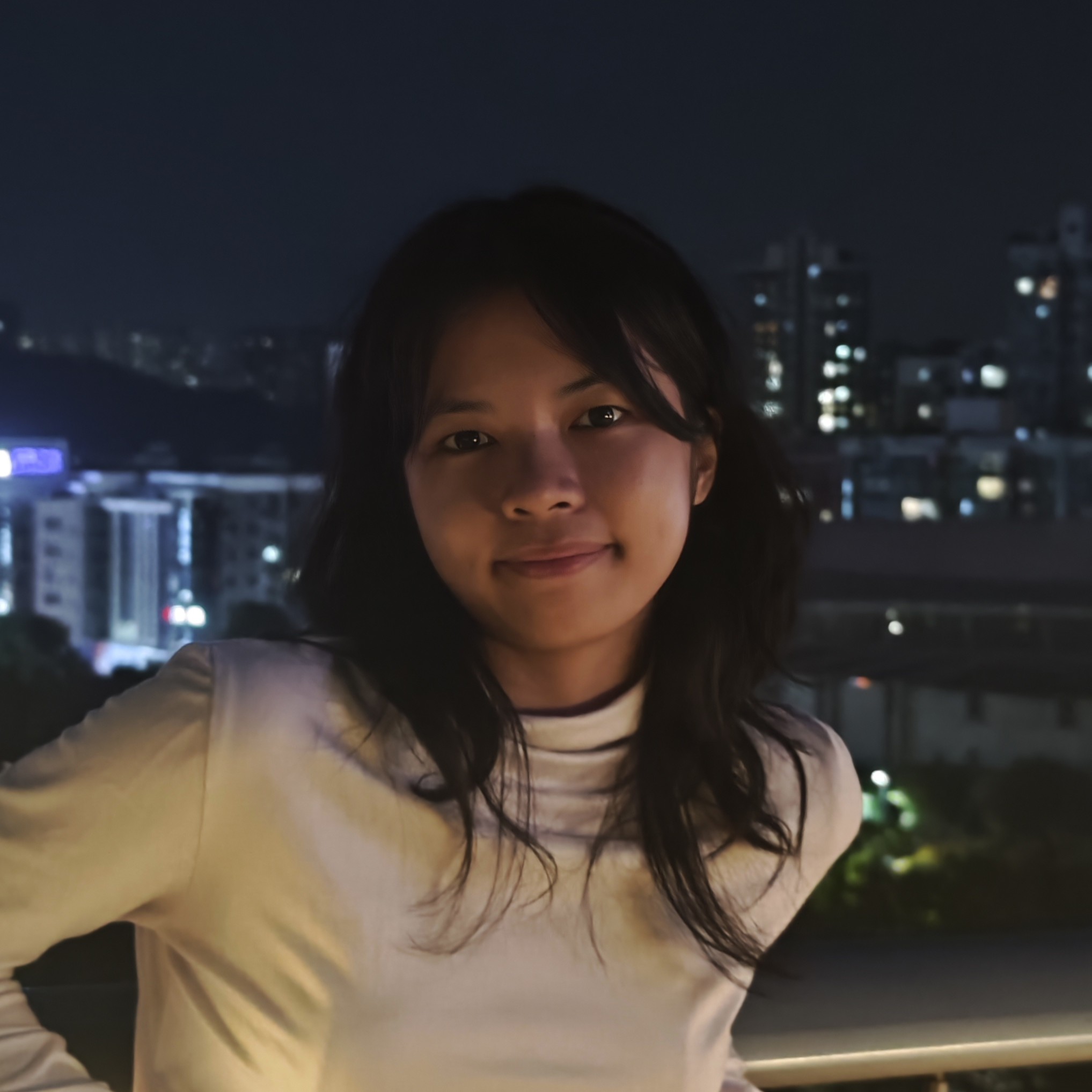 A picture of Sarah smiling at the camera